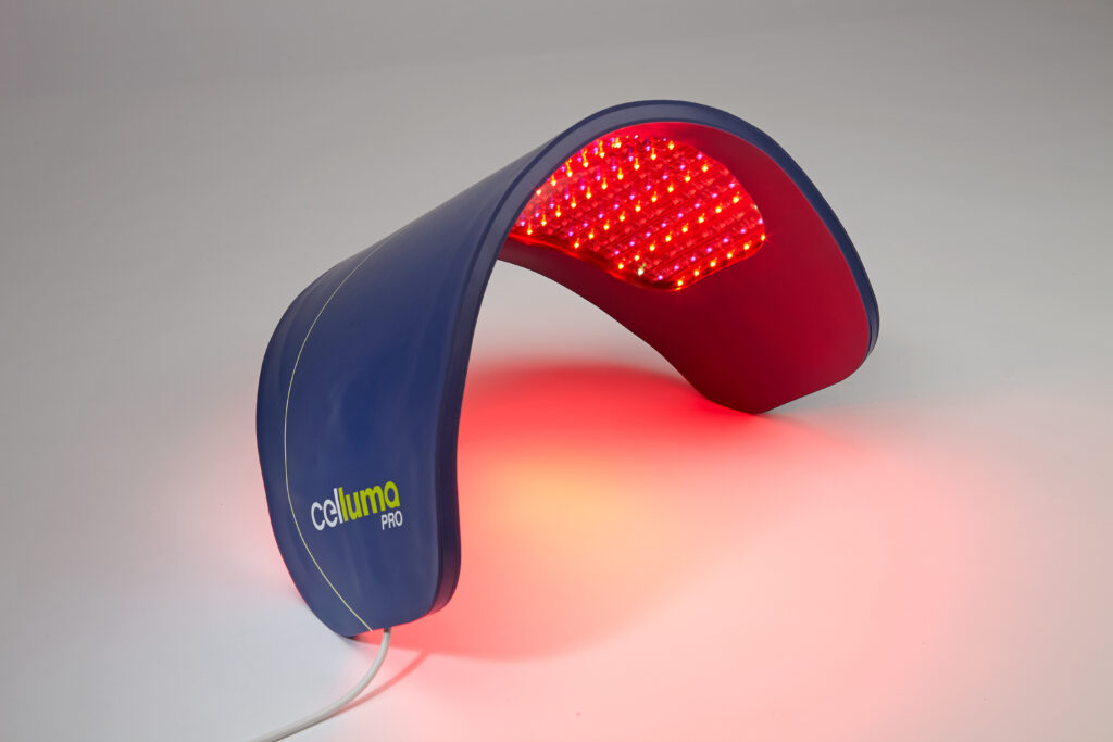a picture of the celluma led light therapy pro device, blue oval curved device with red lights on one side